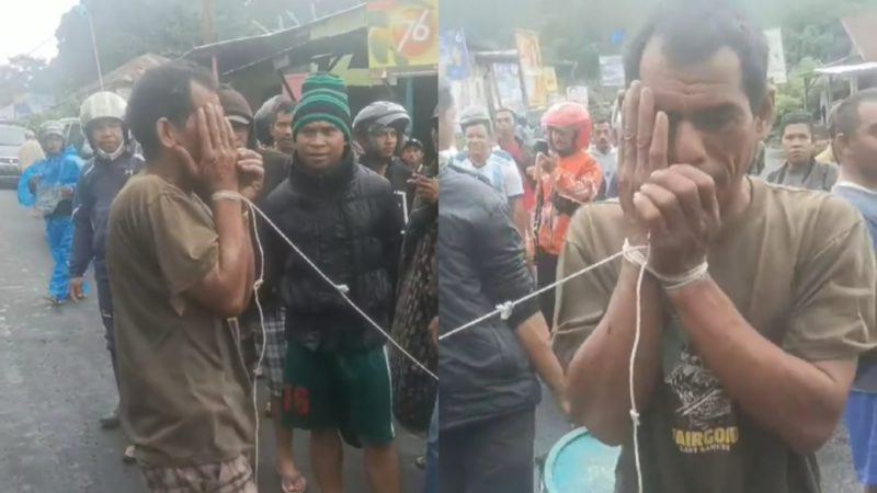 Tangkap layar seorang pria diduga sebagai pencuri babi di Bealaing, Manggarai diarak warga dengan kondisi tangan dan kaki diikat dengan tali (Tajukflores.com)